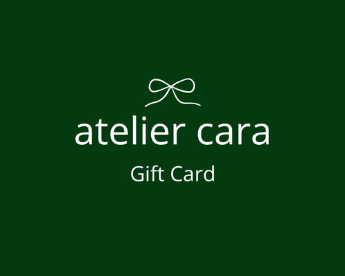 Atelier Cara gift card with a green background