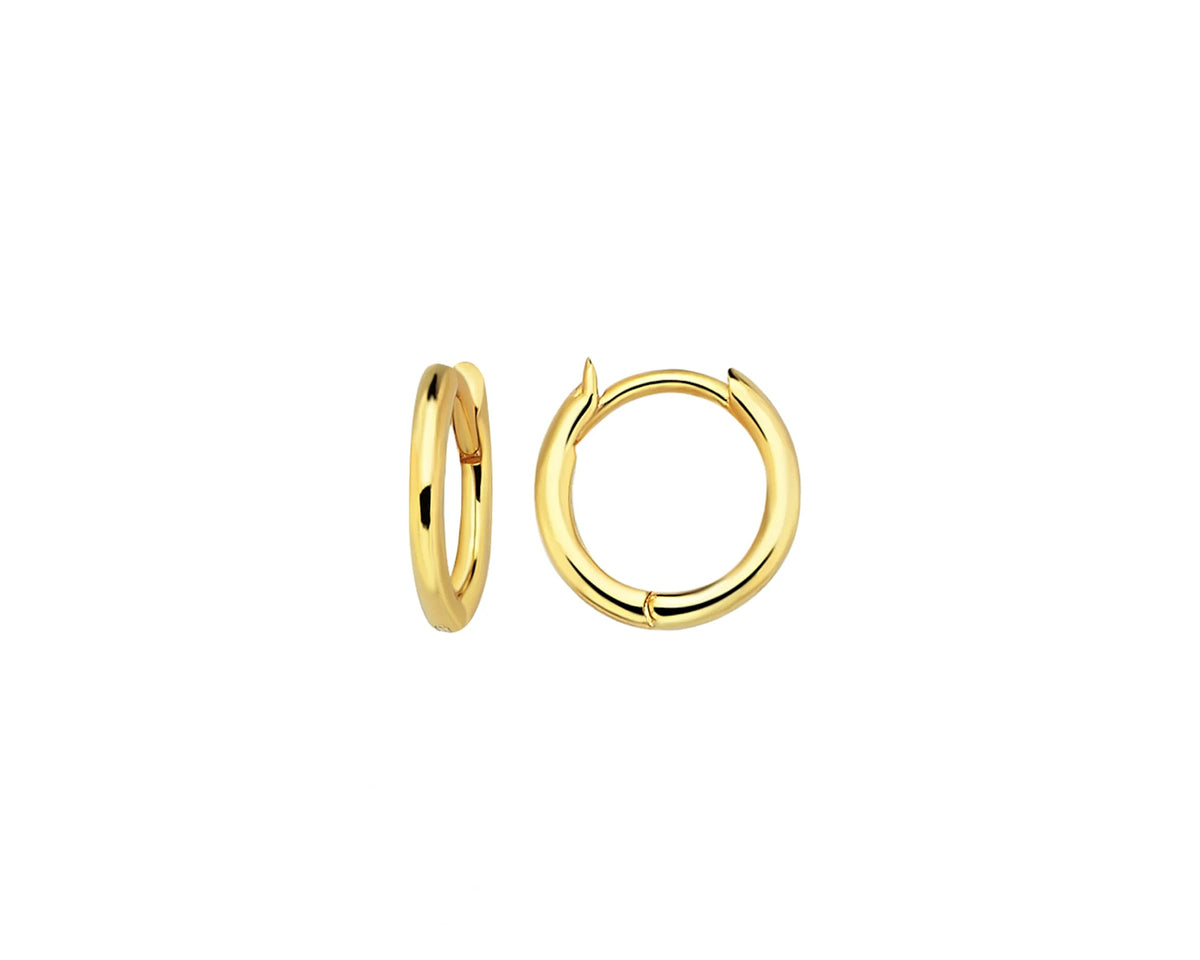 A pair of polished yellow gold huggie hoop earrings shown on a plain white background.
