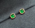 Elizabeth Emerald Studs on a green background