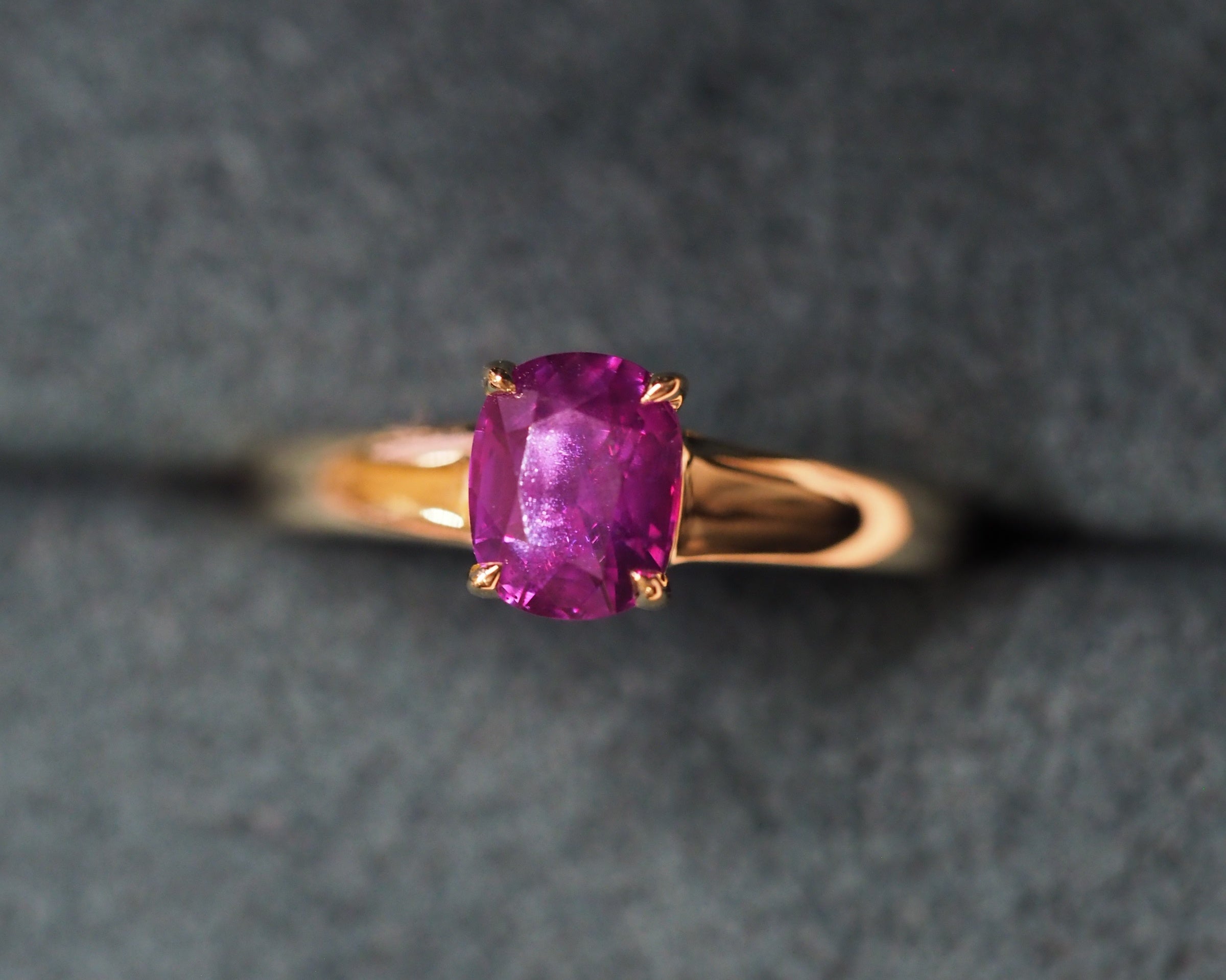 Purple stone ring in a box